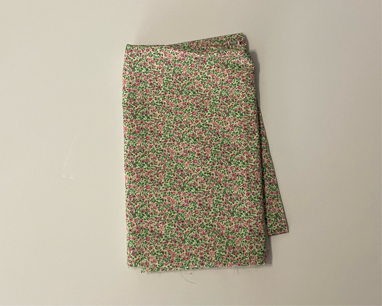 Green and pink tiny floral print cotton woven